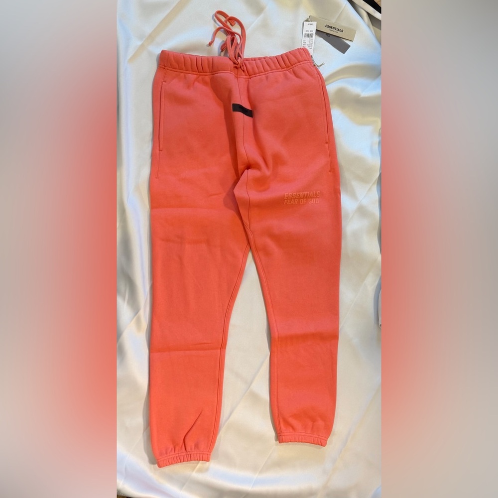 FEAR OF GOD ESSENTIALS - Tapered Logo Blend Jersey Sweatpants in Coral - Picture 6 of 11